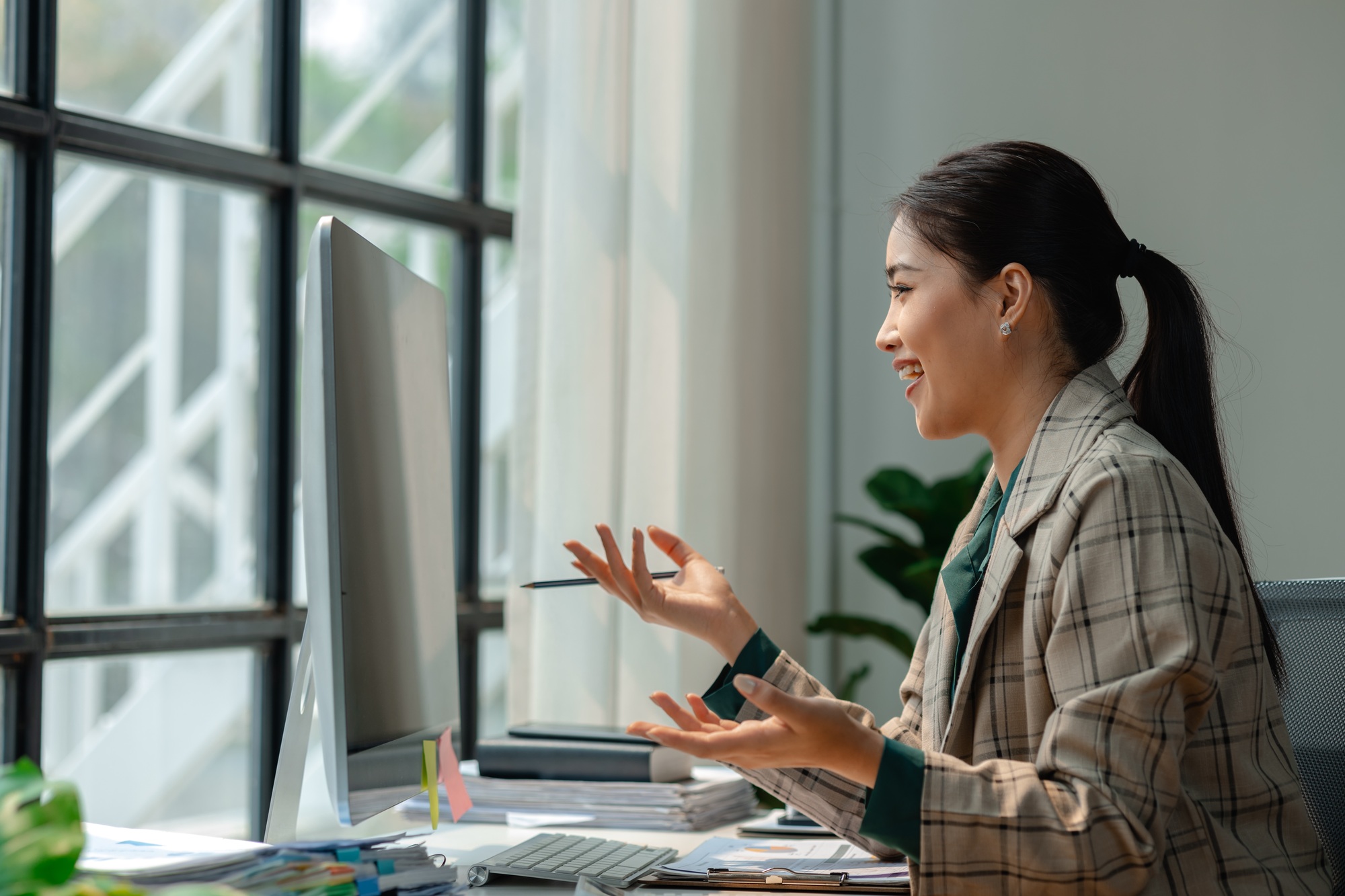 a businesswoman is attending video conference with her team to discussion about marketing strategy,