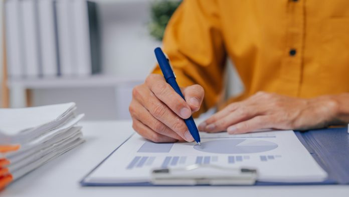 Young Serious asia people bookkeeper doing bookkeeping entrepreneur small business owner accountant